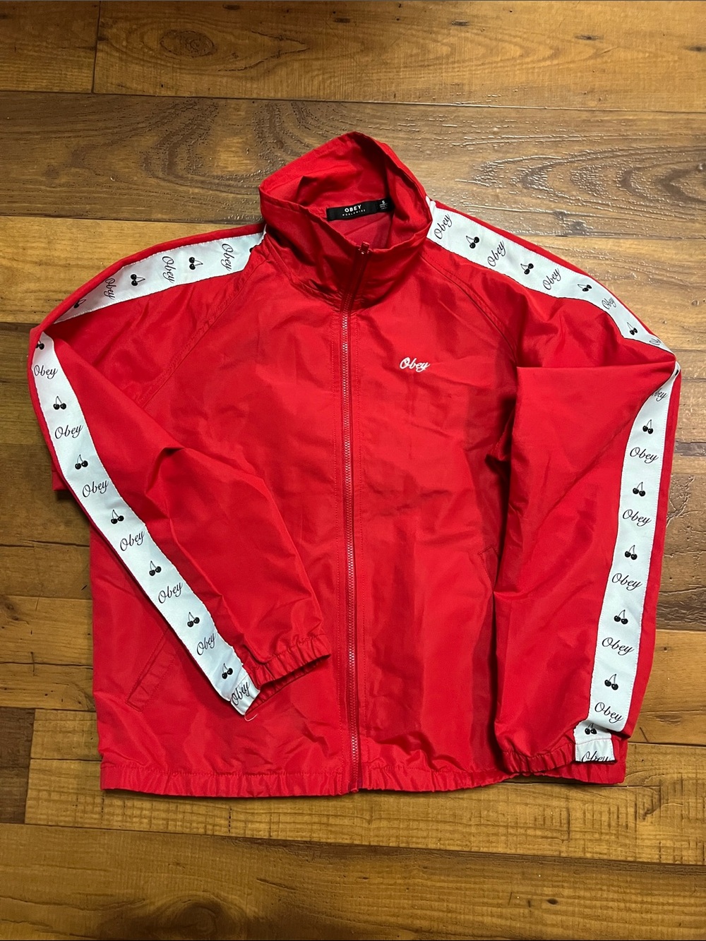 Obey vintage coach jacket size small women color red with cherry strip on sleeve